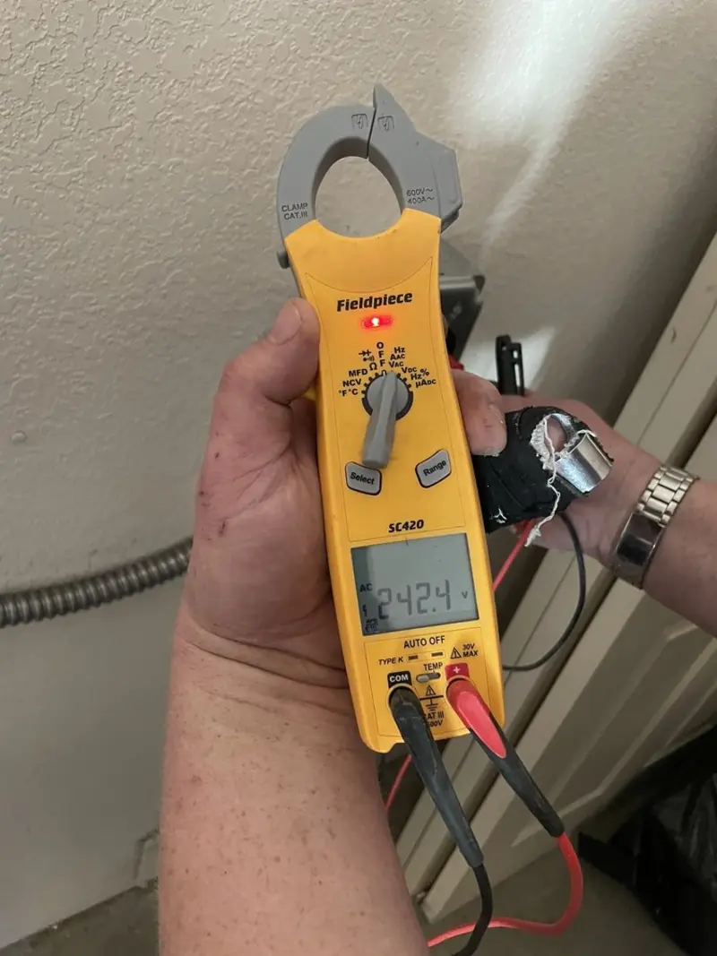 Voltage testing with clamp meter during Aluminum Wiring Replacement in Galliano